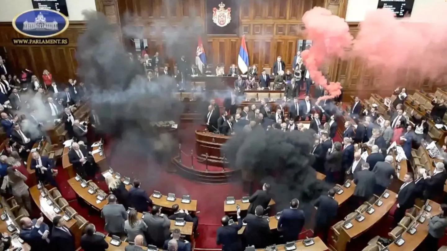 Serbian lawmakers throw smoke grenades, tear gas in parliament